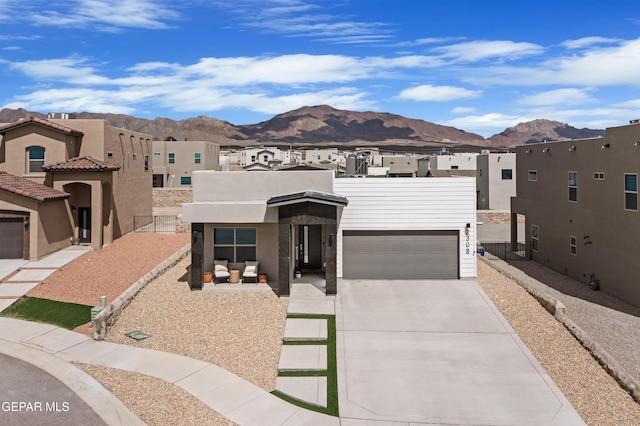 2308 Enchanted Quail, El Paso, TX 79911 - view of front of home featuring a mountain view, a residential view, driveway, and stucco siding