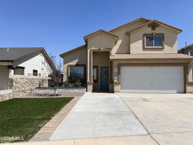 1160 Cielo Mar Dr, Socorro, TX 79927 - view of front facade with stucco siding, concrete driveway, a garage, and a front yard