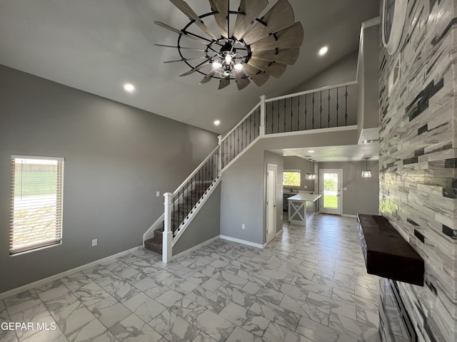 1160 Cielo Mar Dr, Socorro, TX 79927 - entrance foyer featuring light marble finish floors, recessed lighting, stairs, a ceiling fan, and high vaulted ceiling