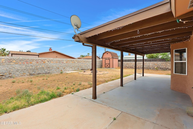 2912 Chaswood St, El Paso, TX 79935 - fenced backyard with a patio and a storage unit