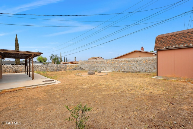 2912 Chaswood St, El Paso, TX 79935 - fenced backyard with a patio