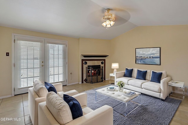 2912 Chaswood St, El Paso, TX 79935 - living room featuring ceiling fan, light tile patterned floors, healthy amount of natural light, and vaulted ceiling
