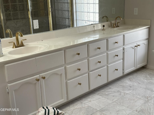 1005 Singing Hills Dr, El Paso, TX 79912 - full bath with marble look tiles, double vanity, and a tile shower