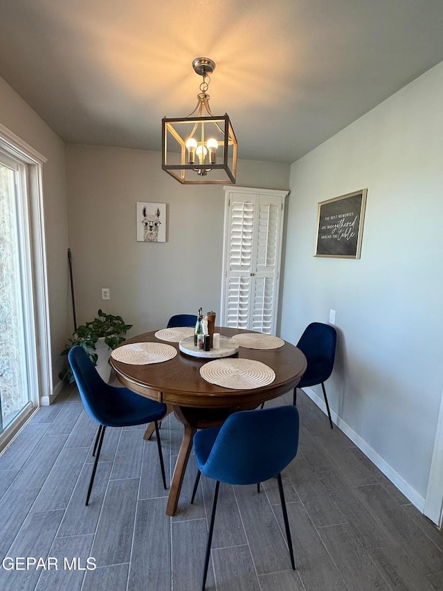 1005 Singing Hills Dr, El Paso, TX 79912 - dining space with dark wood-type flooring and a chandelier
