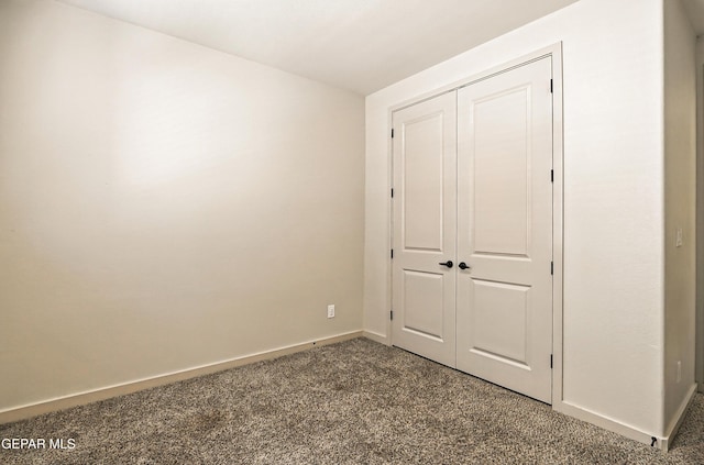 14512 Dominic Azcarate Dr, El Paso, TX 79938 - unfurnished bedroom with dark carpet and a closet