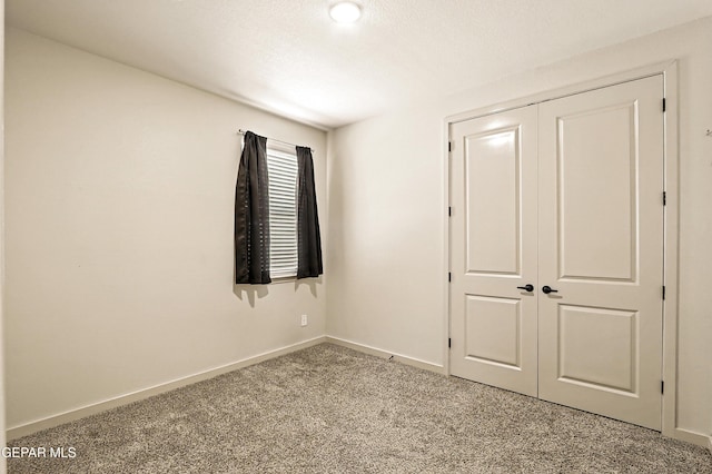 14512 Dominic Azcarate Dr, El Paso, TX 79938 - unfurnished bedroom featuring carpet floors and a closet