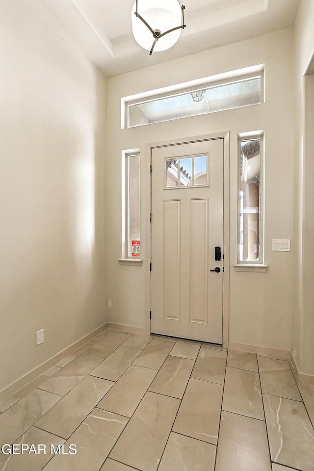 14512 Dominic Azcarate Dr, El Paso, TX 79938 - entrance foyer with baseboards and a raised ceiling