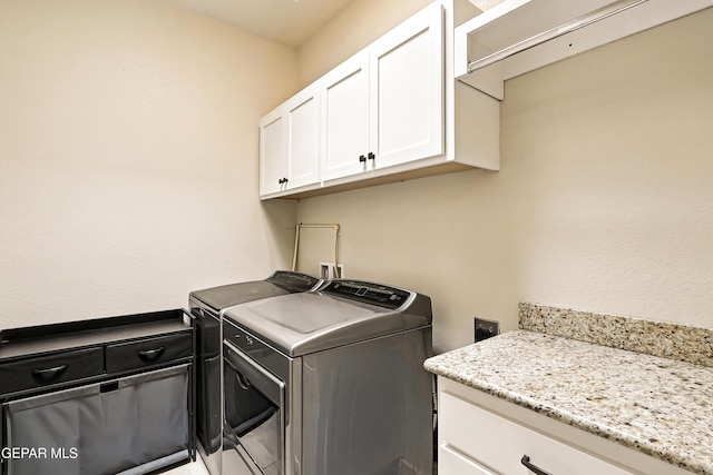 14512 Dominic Azcarate Dr, El Paso, TX 79938 - laundry area with washing machine and dryer and cabinet space