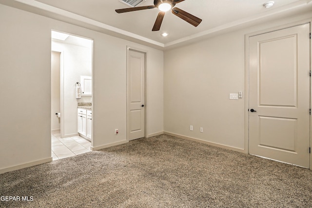 14512 Dominic Azcarate Dr, El Paso, TX 79938 - unfurnished bedroom featuring light carpet, recessed lighting, connected bathroom, light tile patterned floors, and a ceiling fan