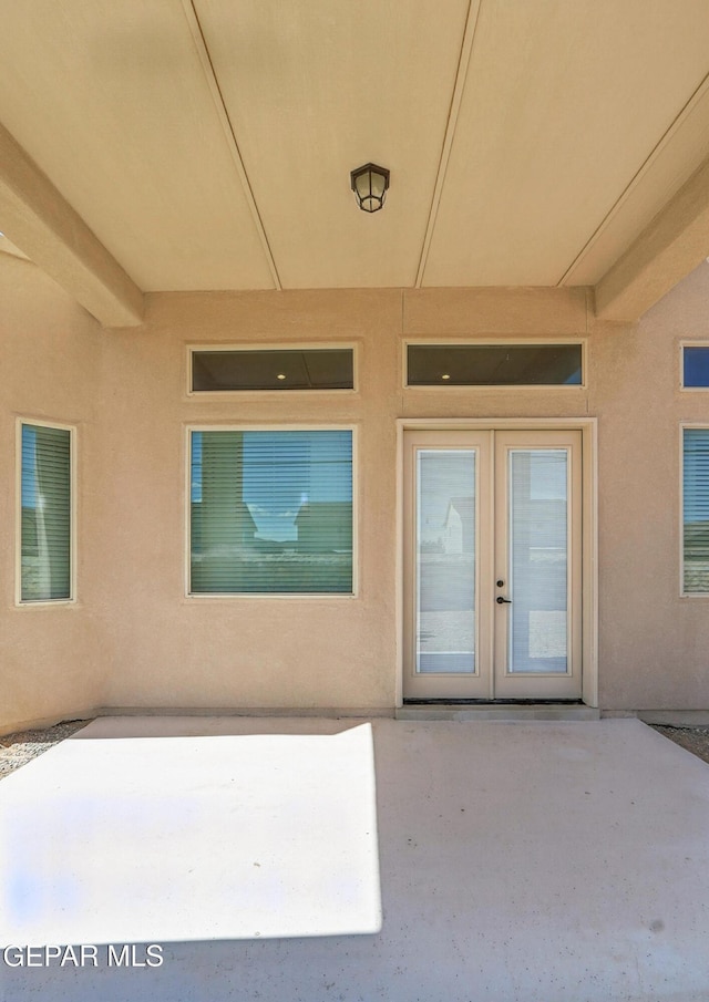 14512 Dominic Azcarate Dr, El Paso, TX 79938 - property entrance featuring french doors, a patio area, and stucco siding