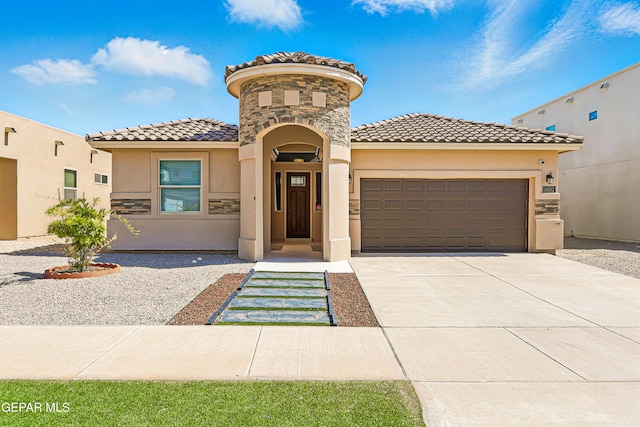 14512 Dominic Azcarate Dr, El Paso, TX 79938 - mediterranean / spanish home with a tile roof, stucco siding, a garage, concrete driveway, and stone siding