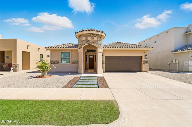 14512 Dominic Azcarate Dr, El Paso, TX 79938 - mediterranean / spanish house with stucco siding, an attached garage, concrete driveway, and a tiled roof