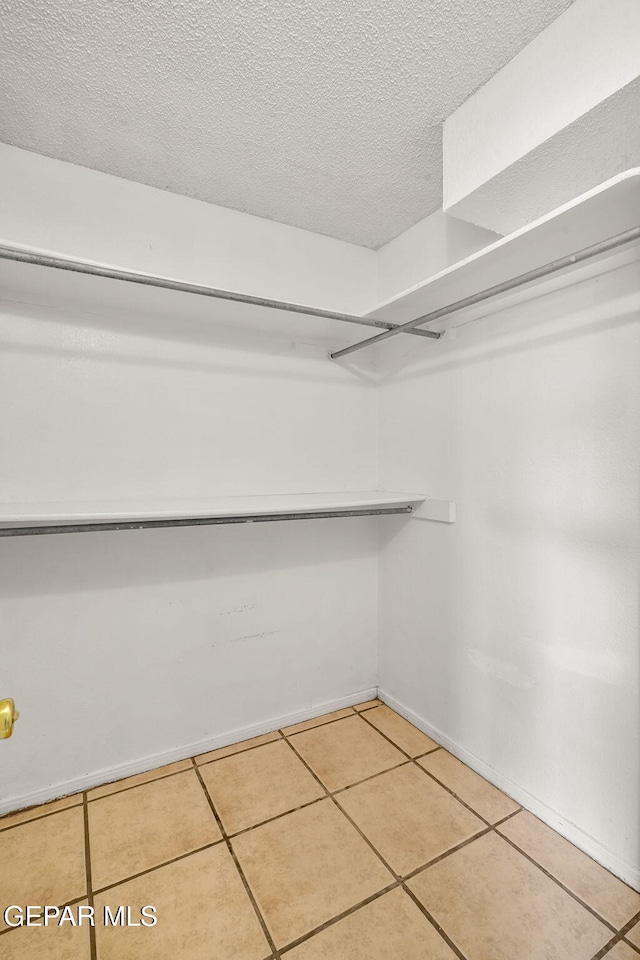 3009 Lake Champlain St, El Paso, TX 79936 - walk in closet with tile patterned flooring