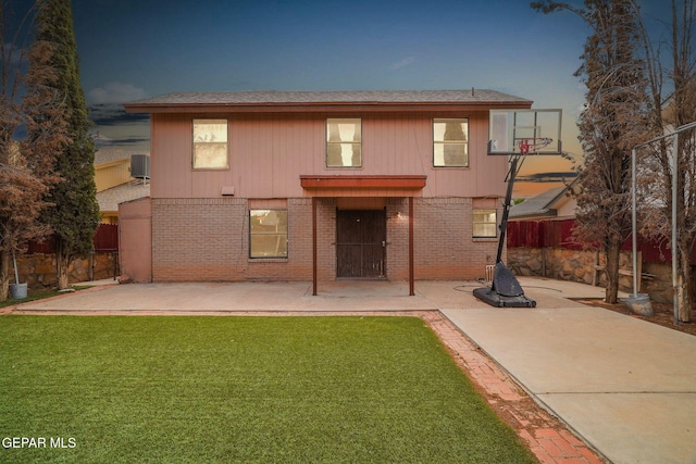 3009 Lake Champlain St, El Paso, TX 79936 - rear view of house with a patio, brick siding, and a shingled roof