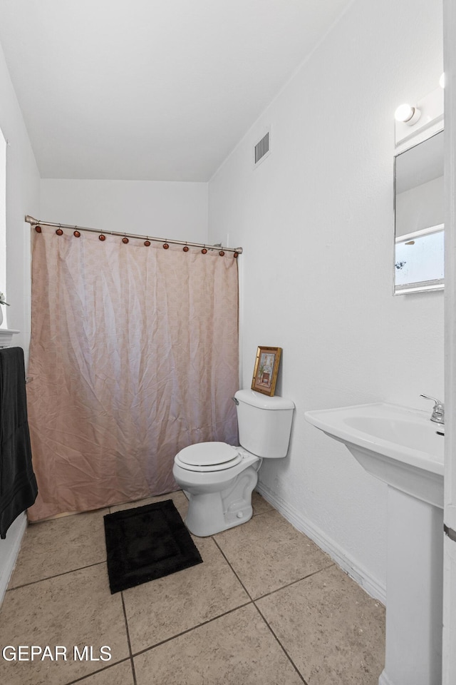 12290 Tierra Bella Dr, El Paso, TX 79938 - full bath with tile patterned floors and a shower with curtain