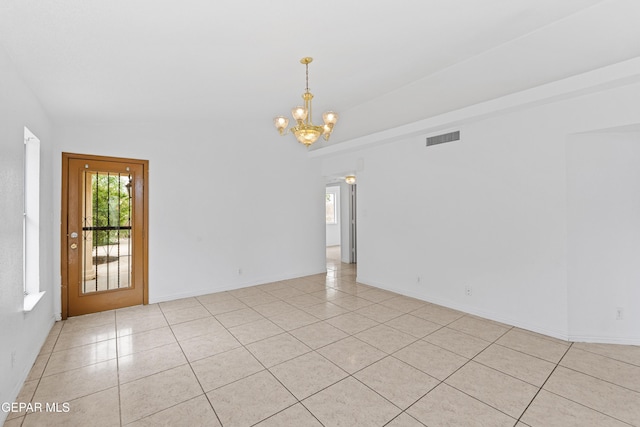 12290 Tierra Bella Dr, El Paso, TX 79938 - empty room with a chandelier and light tile patterned floors