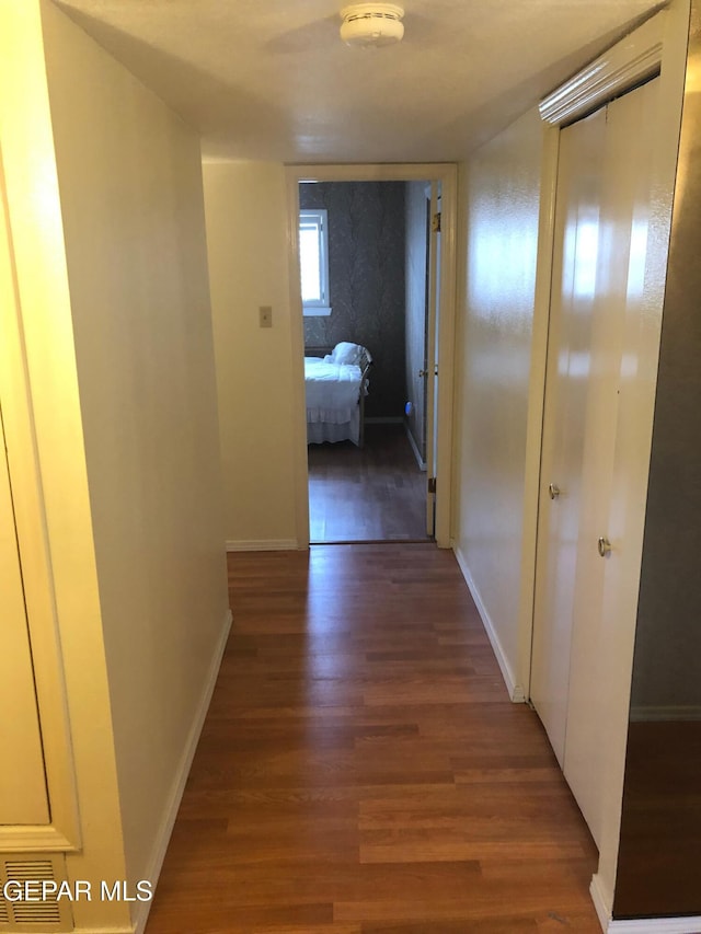 10309 Woodruff Ct, El Paso, TX 79925 - hallway featuring wood finished floors and baseboards
