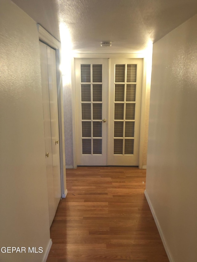 10309 Woodruff Ct, El Paso, TX 79925 - corridor featuring wood finished floors and baseboards