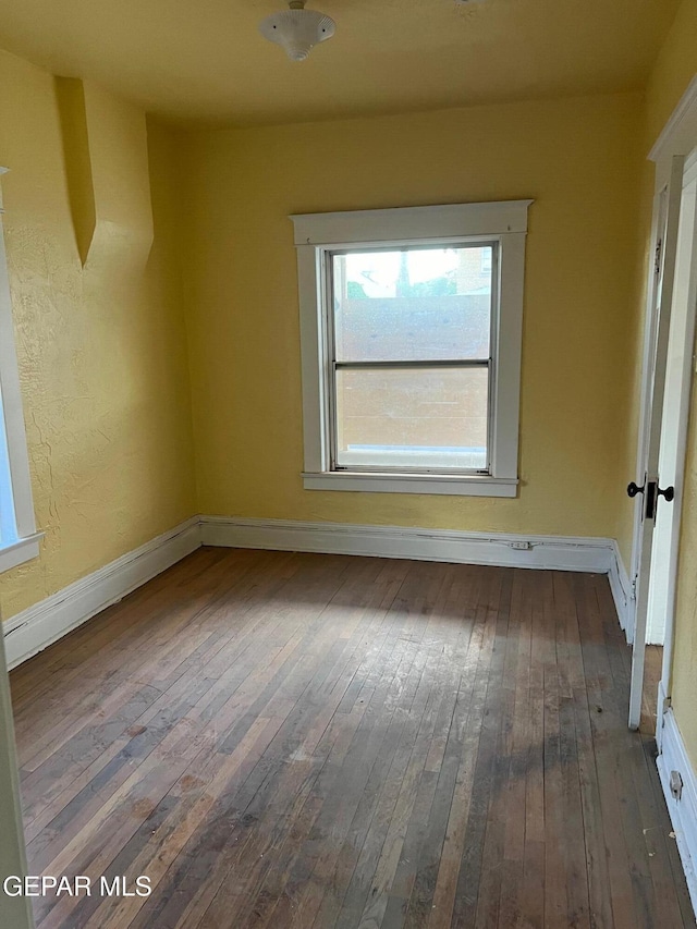 1118 N Laurel St, El Paso, TX 79902 - spare room featuring hardwood / wood-style flooring and baseboards