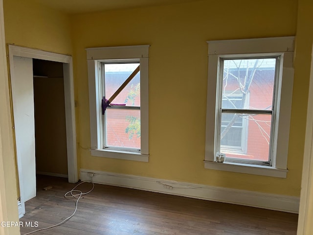 1118 N Laurel St, El Paso, TX 79902 - unfurnished bedroom with wood finished floors and baseboards