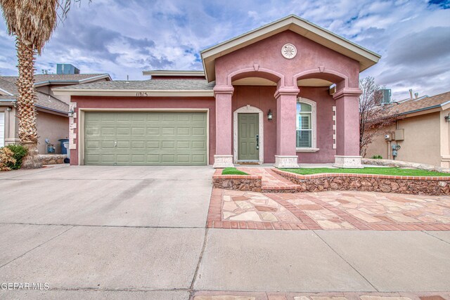 11813 Deer Grass Cir, El Paso, TX 79936 - view of front of house featuring concrete driveway, an attached garage, and stucco siding