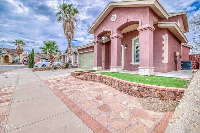 11813 Deer Grass Cir, El Paso, TX 79936 - property entrance featuring stucco siding, driveway, and an attached garage