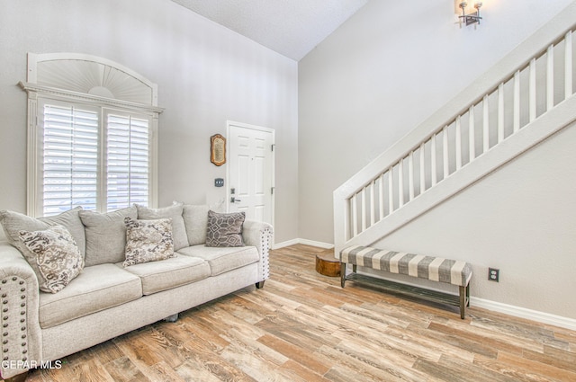 11813 Deer Grass Cir, El Paso, TX 79936 - living room featuring high vaulted ceiling, wood finished floors, and stairs