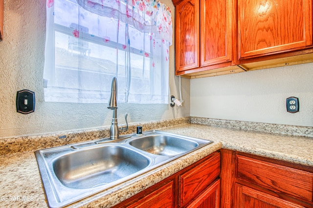 11813 Deer Grass Cir, El Paso, TX 79936 - kitchen featuring light countertops and a textured wall