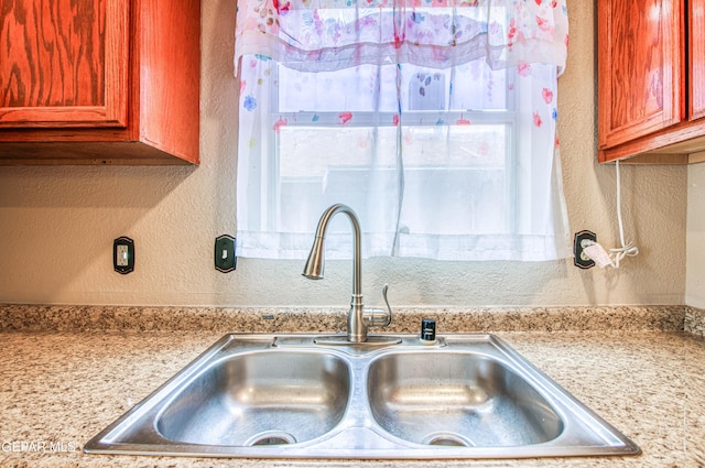 11813 Deer Grass Cir, El Paso, TX 79936 - kitchen view of a textured wall and a sink