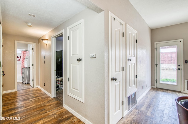 11813 Deer Grass Cir, El Paso, TX 79936 - hall featuring dark wood-style flooring and baseboards