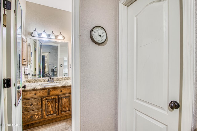 11813 Deer Grass Cir, El Paso, TX 79936 - bathroom featuring vanity and a textured wall
