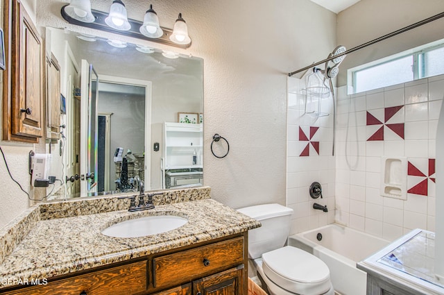 11813 Deer Grass Cir, El Paso, TX 79936 - full bathroom with vanity, a textured wall, and bathing tub / shower combination
