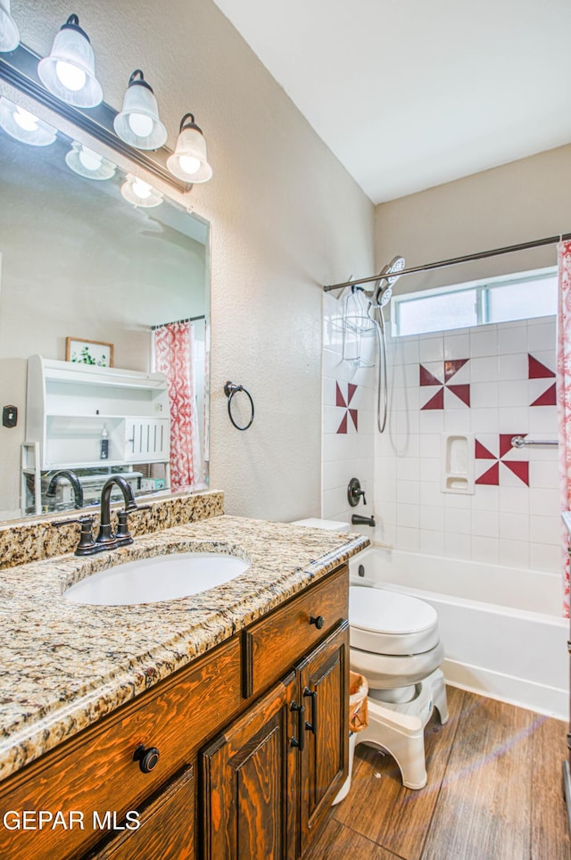 11813 Deer Grass Cir, El Paso, TX 79936 - full bathroom with vanity, shower / bath combo, wood finished floors, and a textured wall