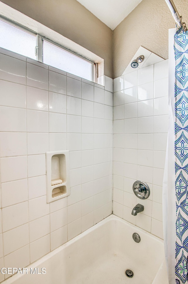 11813 Deer Grass Cir, El Paso, TX 79936 - bathroom featuring shower / bath combo with shower curtain