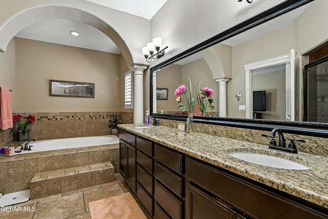 14552 Long Shadow Ave, El Paso, TX 79938 - full bath with ornate columns, a garden tub, double vanity, and tiled shower