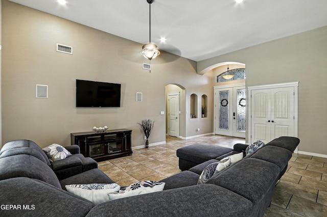 14552 Long Shadow Ave, El Paso, TX 79938 - living room featuring arched walkways, ceiling fan, a high ceiling, tile patterned floors, and recessed lighting