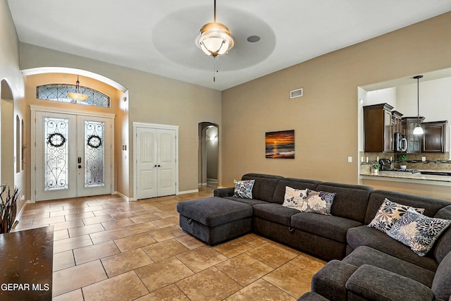 14552 Long Shadow Ave, El Paso, TX 79938 - living area with arched walkways, a ceiling fan, and light tile patterned flooring