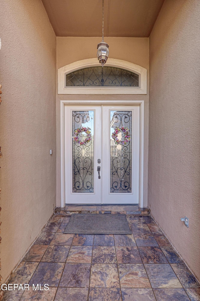 14552 Long Shadow Ave, El Paso, TX 79938 - property entrance featuring stucco siding and french doors