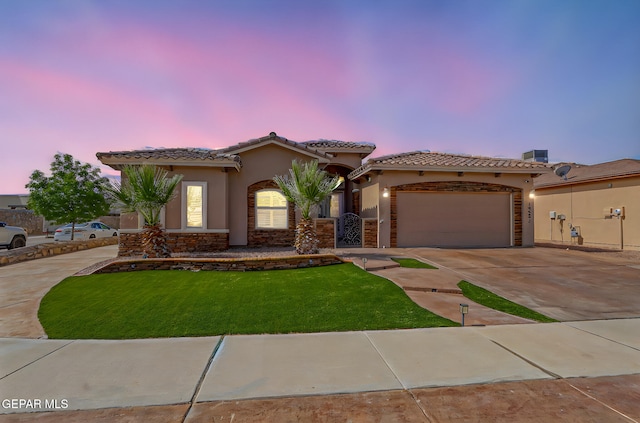 14552 Long Shadow Ave, El Paso, TX 79938 - mediterranean / spanish home featuring stucco siding, a garage, driveway, and a tiled roof