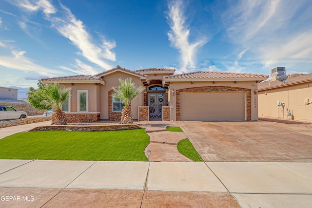 14552 Long Shadow Ave, El Paso, TX 79938 - mediterranean / spanish-style home featuring stucco siding, driveway, and a tile roof