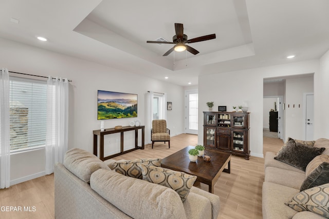 11157 Blazing Star Pl, El Paso, TX 79934 - living room with a ceiling fan, light wood finished floors, a tray ceiling, and recessed lighting