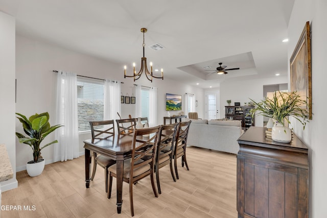 11157 Blazing Star Pl, El Paso, TX 79934 - dining space with a raised ceiling, a chandelier, a ceiling fan, light wood-style flooring, and recessed lighting
