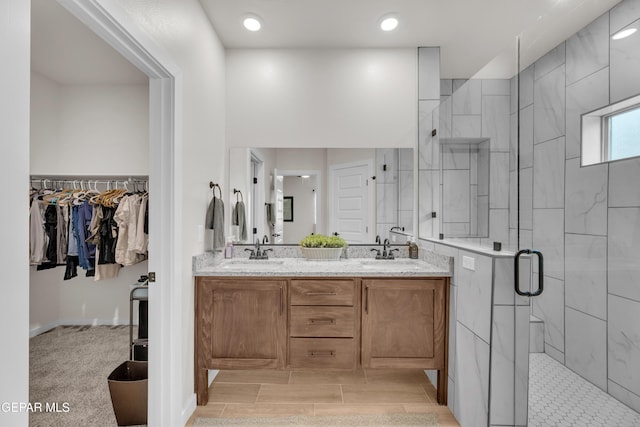 11157 Blazing Star Pl, El Paso, TX 79934 - bathroom featuring a stall shower, double vanity, and a spacious closet