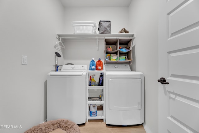 11157 Blazing Star Pl, El Paso, TX 79934 - laundry area with washing machine and clothes dryer and light wood-style flooring
