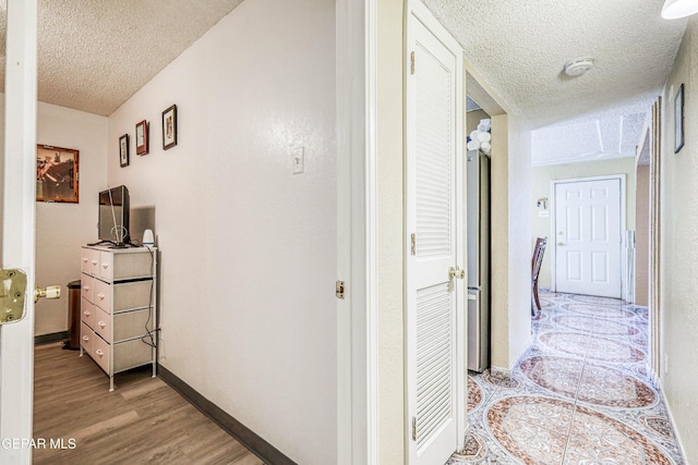 11581 Valle Verde Rd, Socorro, TX 79927 - hall with a textured ceiling and light wood-style flooring