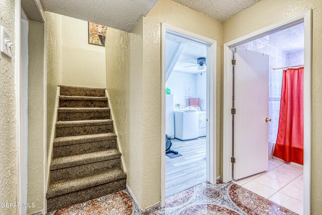 11581 Valle Verde Rd, Socorro, TX 79927 - stairway with separate washer and dryer, a textured ceiling, ceiling fan, and a textured wall