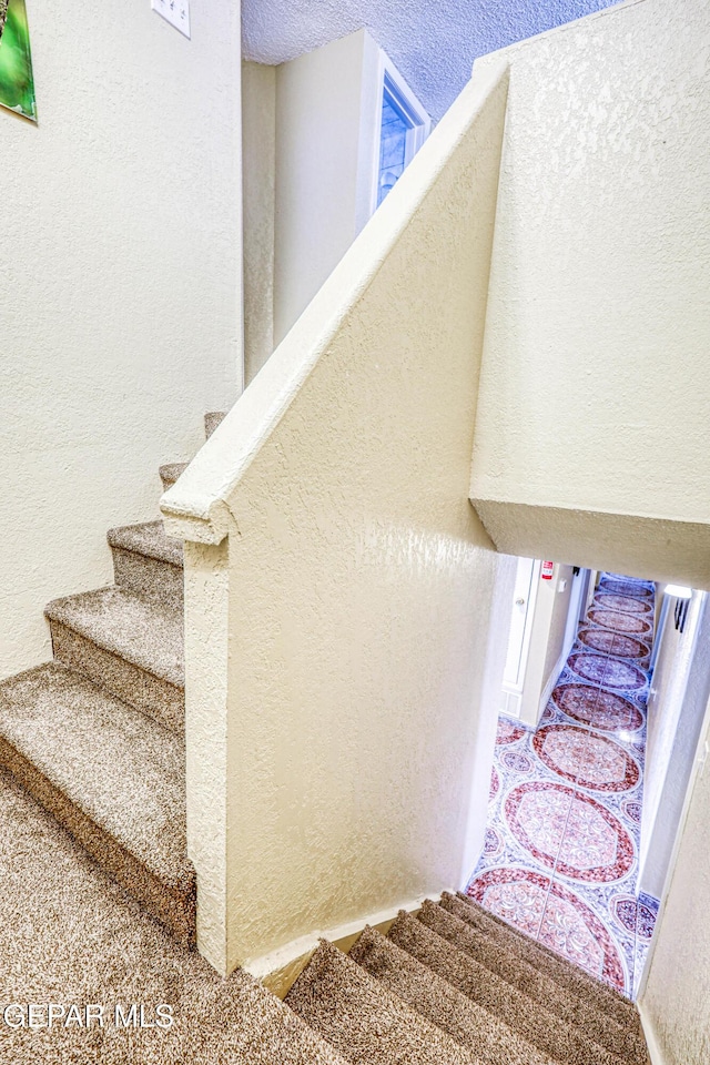 11581 Valle Verde Rd, Socorro, TX 79927 - stairway with a textured wall