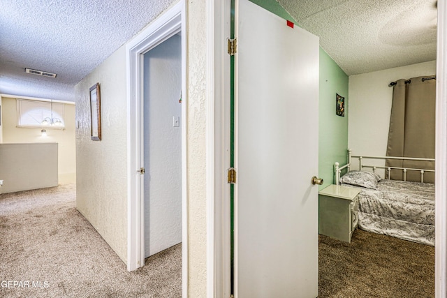 11581 Valle Verde Rd, Socorro, TX 79927 - hall with a textured ceiling and carpet