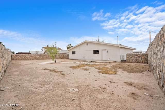 205 Caribe Cir, El Paso, TX 79927 - rear view of house featuring a fenced backyard, brick siding, and a patio