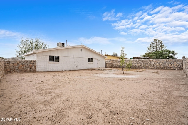 205 Caribe Cir, El Paso, TX 79927 - rear view of property featuring brick siding and a fenced backyard